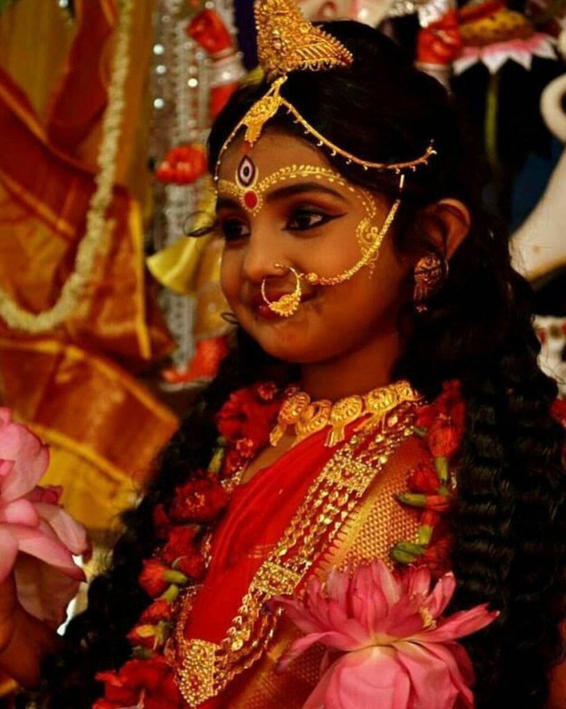Young girl dressed to be worshipped as a Goddess on Kumari Puja